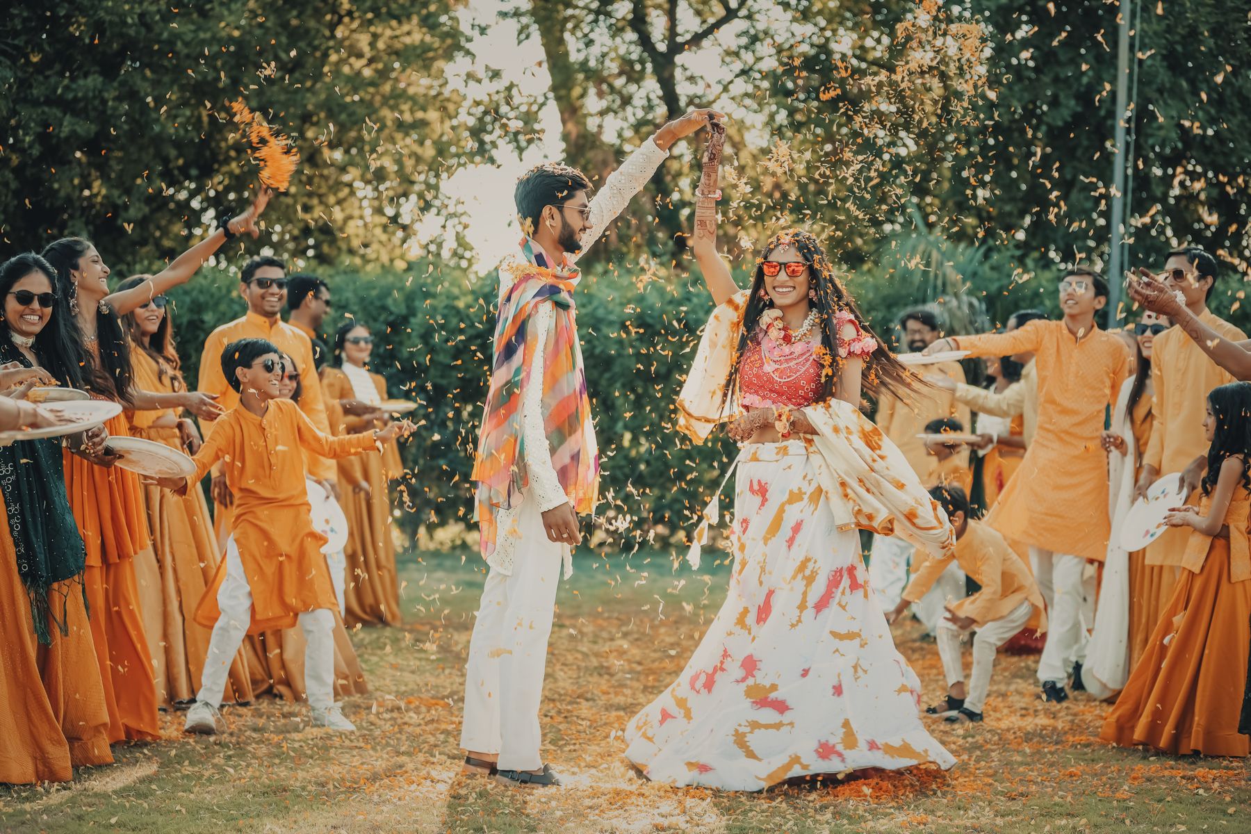Guests celebrating as petals fly