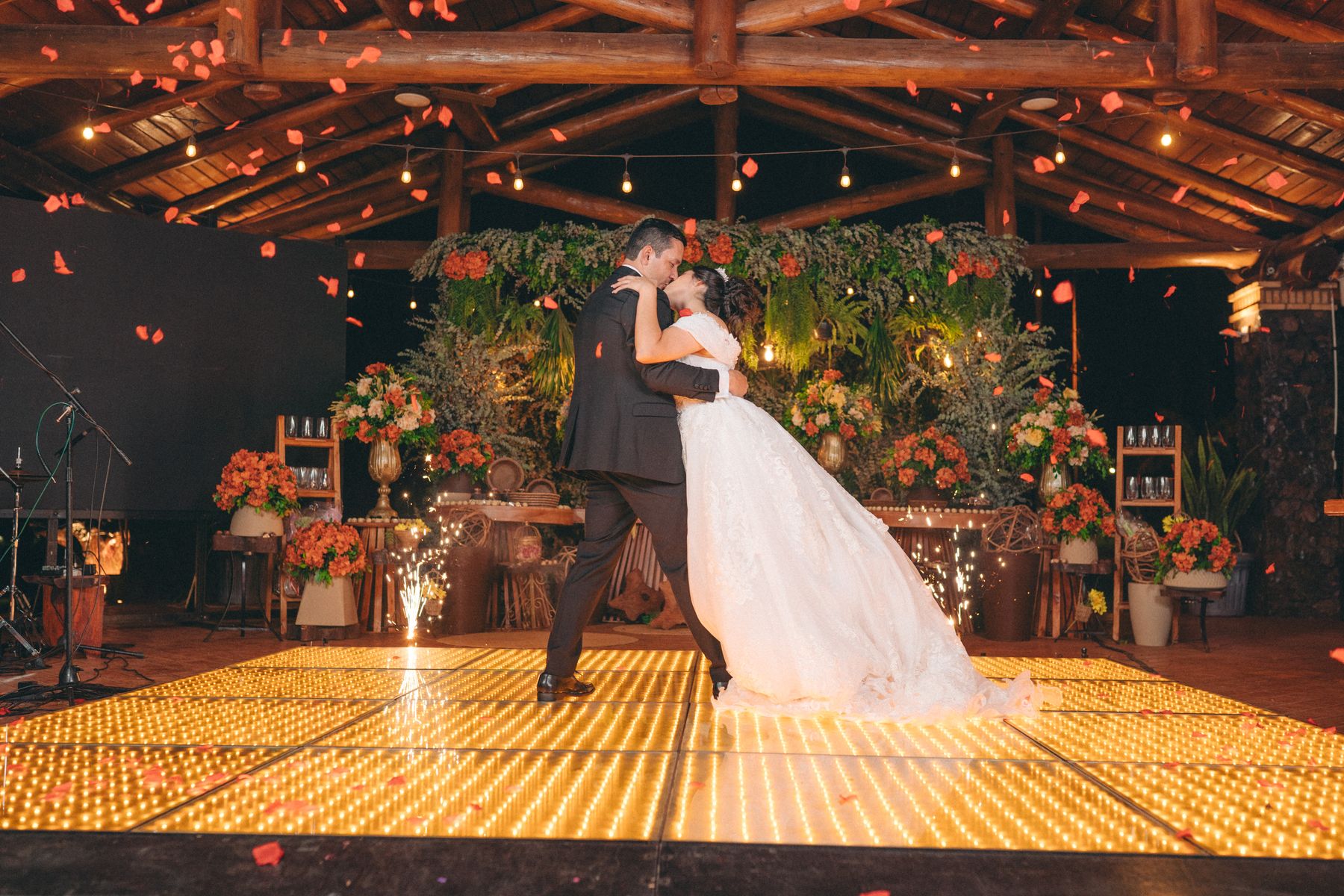 The couple on a glowing dance floor late at night