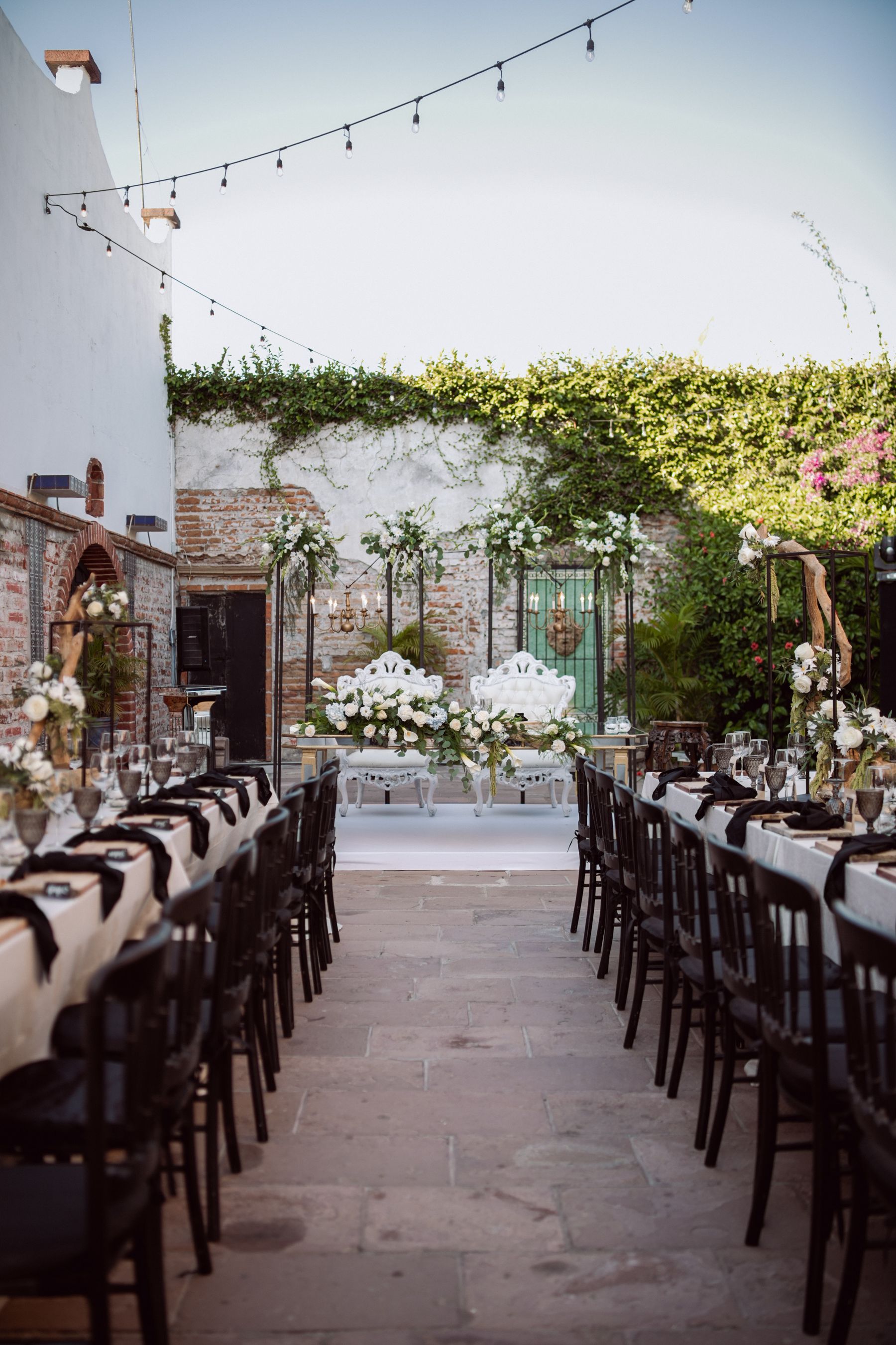 An outdoor reception with festoon lights