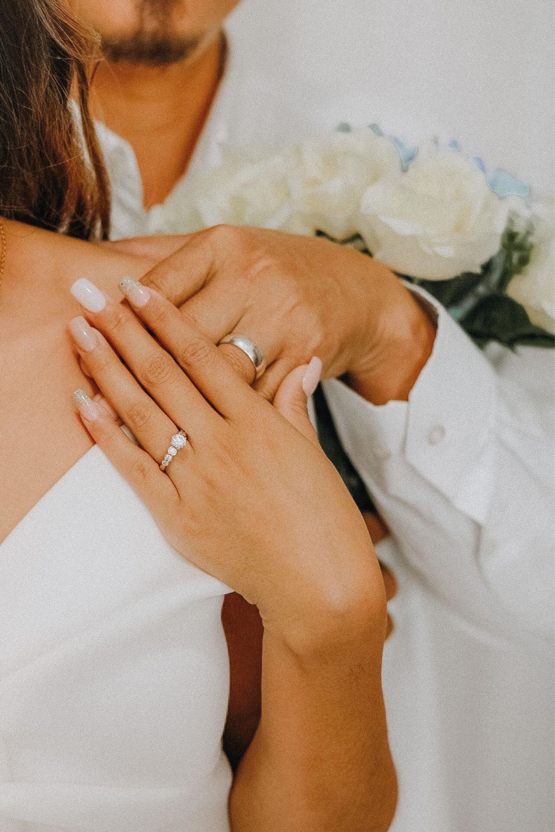 Hands with wedding rings